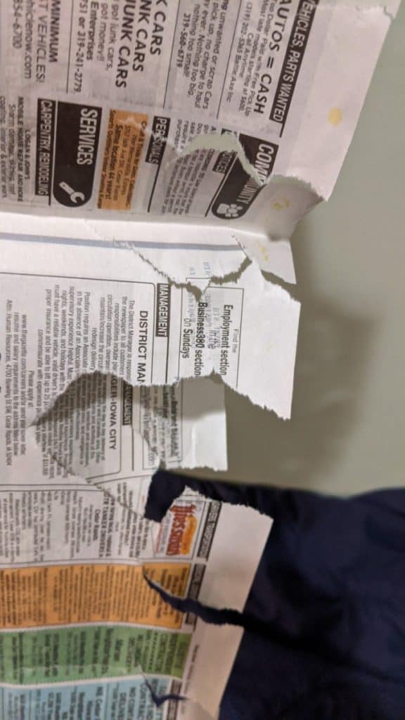 torn newspaper for fire starter